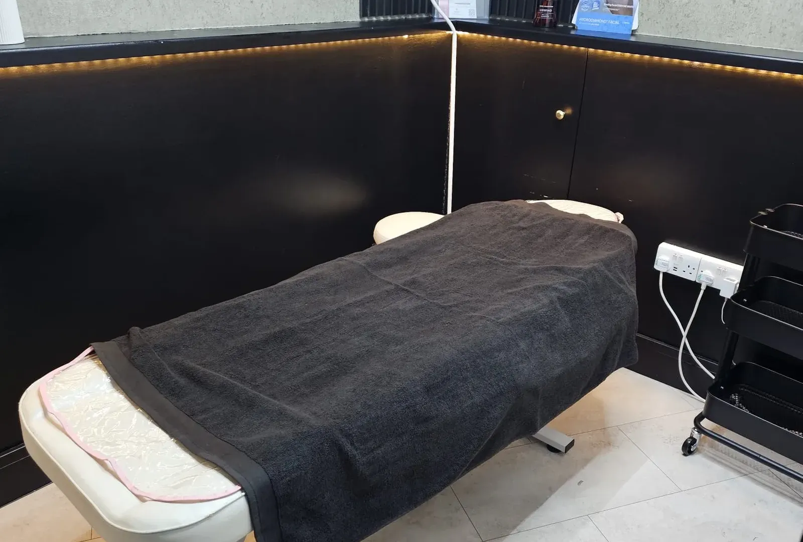 The massage couch made up and ready for a Swedish massage at Wumi Body & Face Studio, Dartford