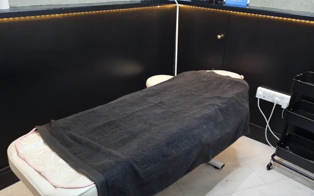 The massage couch made up and ready for a Swedish massage at Wumi Body & Face Studio, Dartford